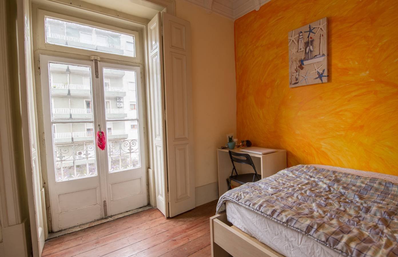 Inviting Room 2 with Natural Light & Balcony Access
